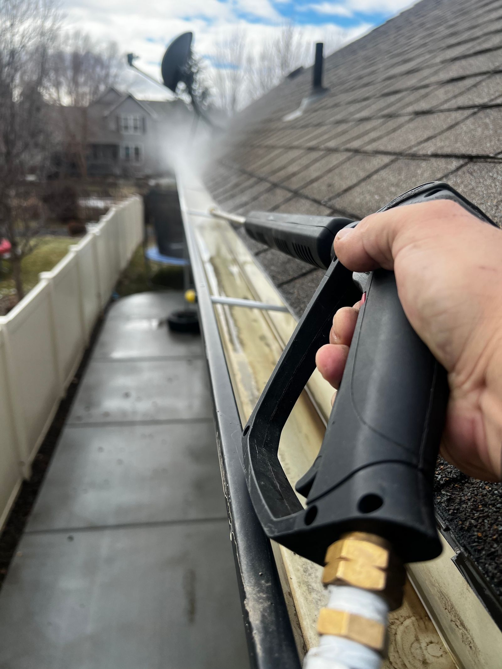 Gutter being cleaned with a high-pressure lance
